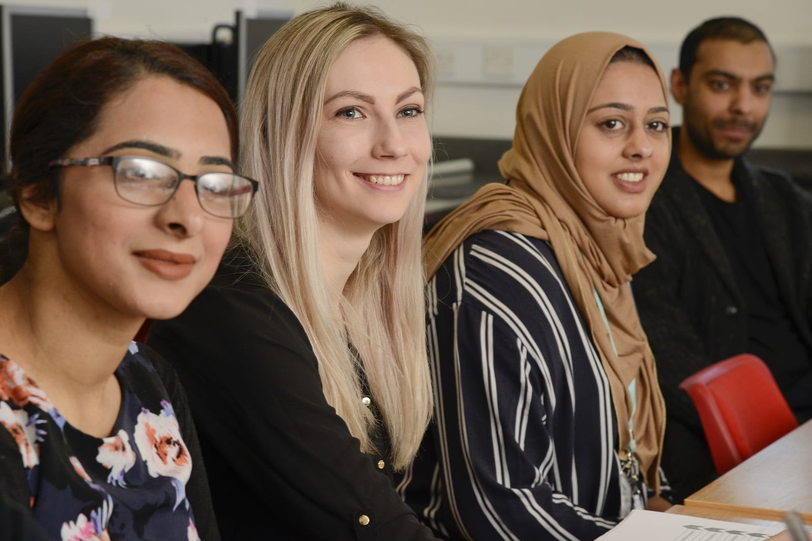 three women smiling, adult learners