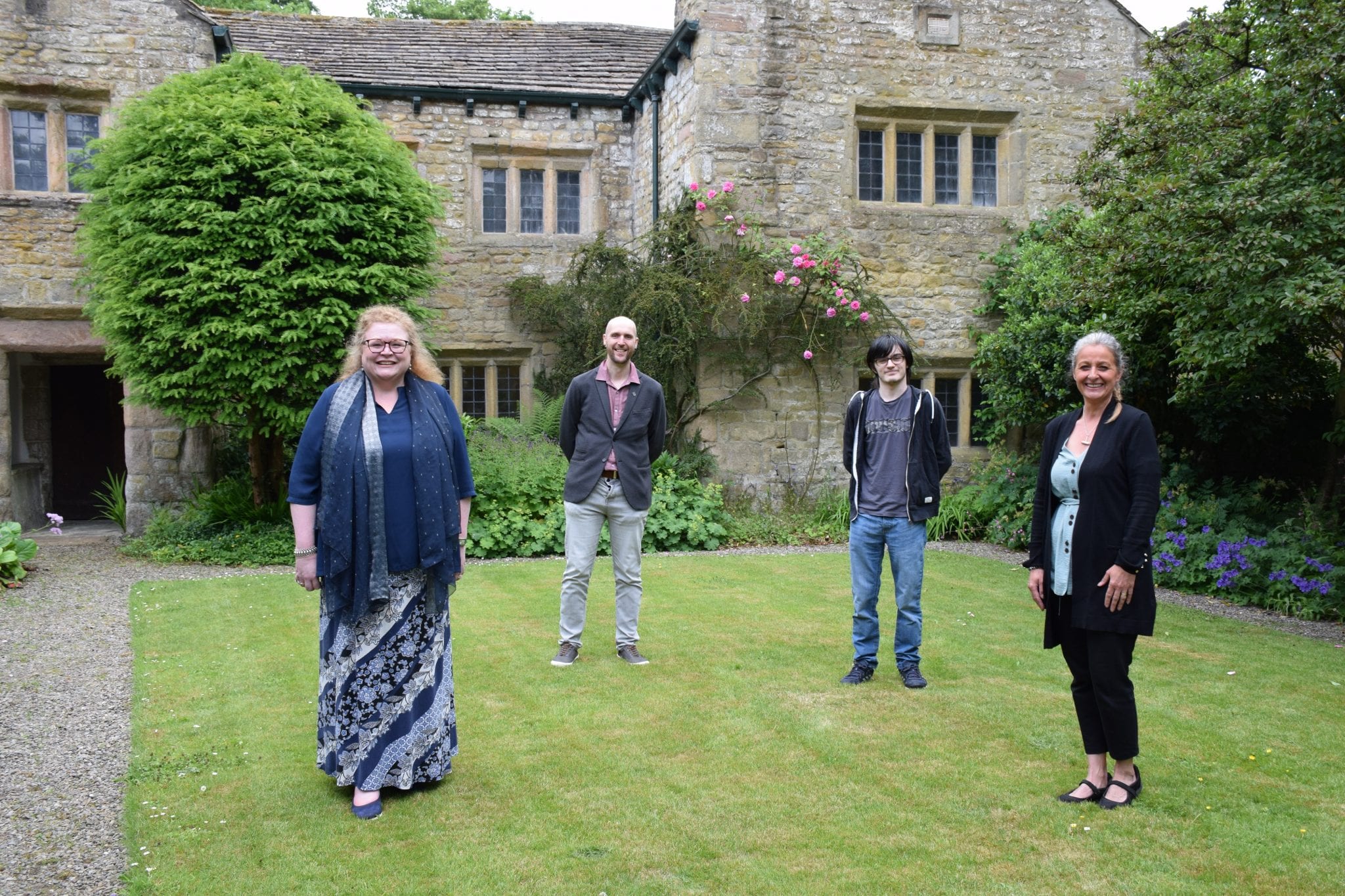 Andrew Ashworth and Connor Russell from Nelson and Colne College with Sarah Cockburn-Price and Rhona Brett from Pendle Heritage Centre.