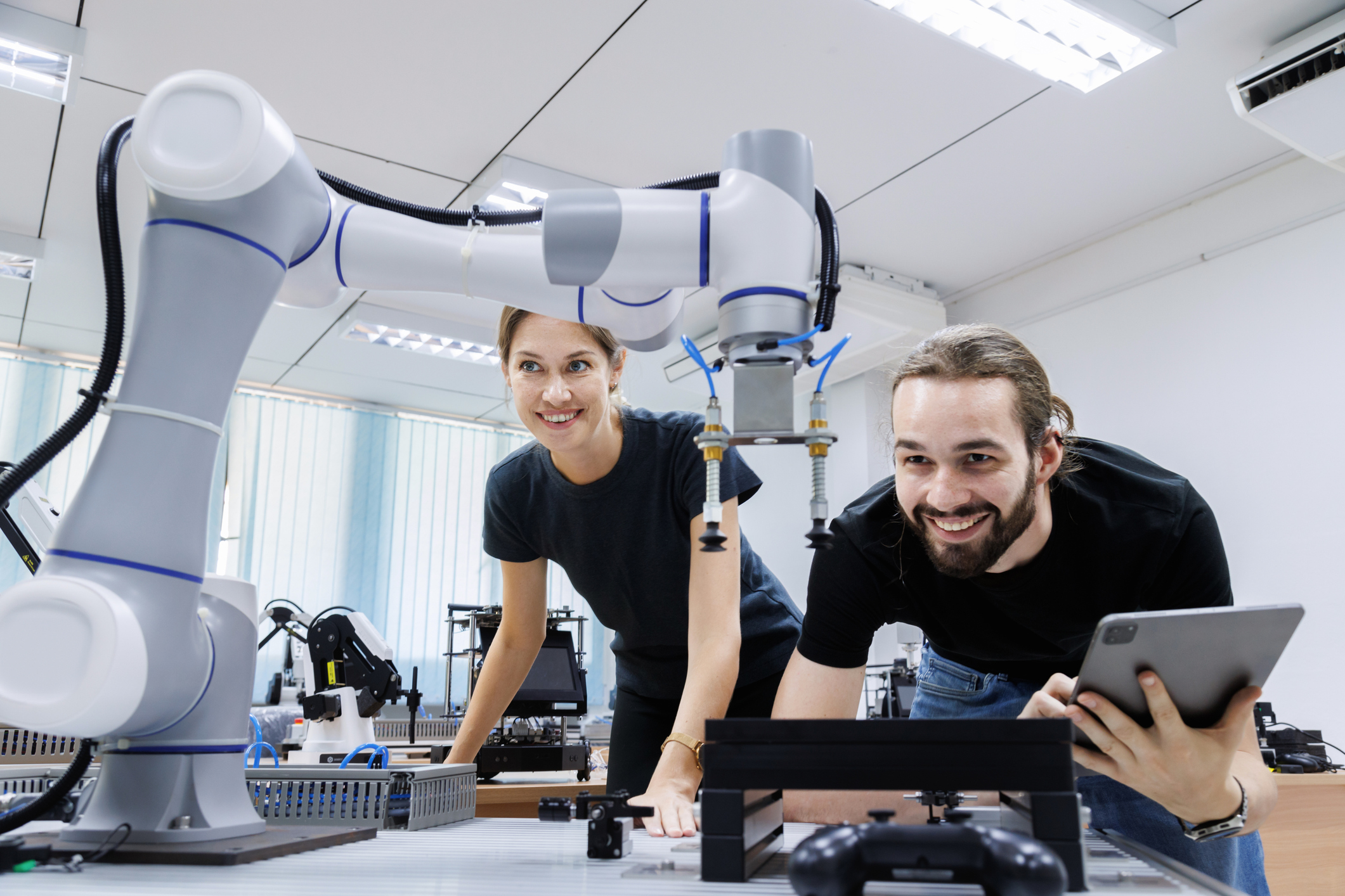 automation machine engineer students study and inspection control robot arm machine in robotics engineering academy at university or factory workshop. AI robot technology, future innovation trend.
